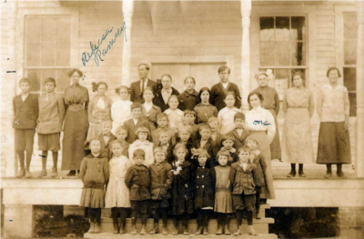 Photograph of teachers and students on the front step of an old schoolhouse in Rockport, Mississippi, in 1914.  